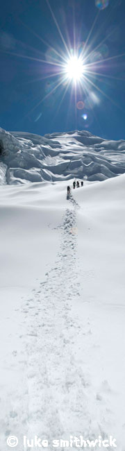 Climbers approach the serac field and crevasses between Camp 1 and Camp 2 on Himlung